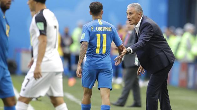 Brazil head coach Tite, right, speaks to Brazil's Philippe Coutinho during the group E match between Brazil and Costa Rica at the 2018 soccer World Cup in the St. Petersburg Stadium in St. Petersburg. (AP) Brazil head coach Tite, right, speaks to Brazil's Philippe Coutinho during the group E match between Brazil and Costa Rica at the 2018 soccer World Cup in the St. Petersburg Stadium in St. Petersburg. (AP)