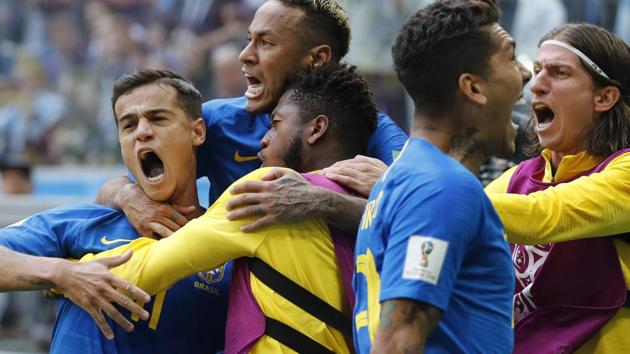 Brazil's Philippe Coutinho, left, celebrates scoring his side's opening goal with Neymar, top, and teammates during the group E match between Brazil and Costa Rica at the 2018 football World Cup in the St. Petersburg Stadium. (AP) Brazil's Philippe Coutinho, left, celebrates scoring his side's opening goal with Neymar, top, and teammates during the group E match between Brazil and Costa Rica at the 2018 football World Cup in the St. Petersburg Stadium. (AP)