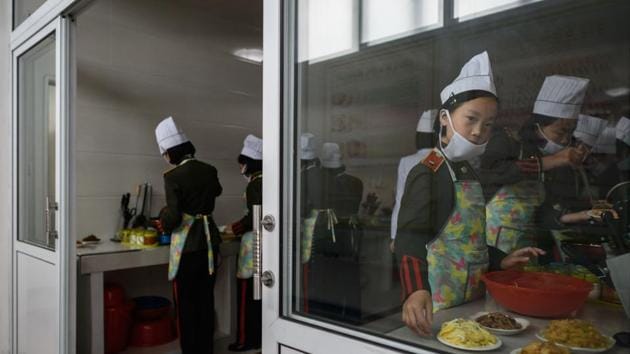 Students take part in cooking lessons at the Kang Pan Sok military academy in Pyongyang, North Korea. (Ed Jones / AFP)