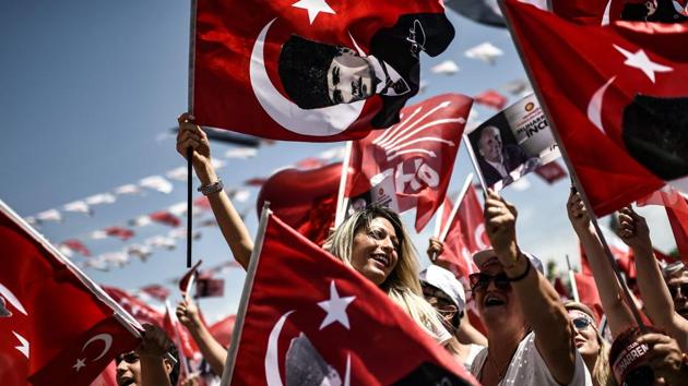 Supporters of Turkey's main opposition party presidential candidate Muharrem Ince cheer during a pre-election speach in Istanbul. (Aris Messinis / AFP)