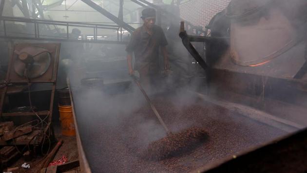 A worker roasts locally grown coffee beans with a traditional wood heated roaster at Kopi Aroma in Bandung, West Java. Many new roasters are offering farmers significantly higher prices for their arabica beans, said Pranoto Soenarto, vice president of the Association of Indonesia Coffee Exporters and Industries. Wooed by the price, farmers are keeping their beans for these micro-roasters, who only buy in small amounts. (Willy Kurniawan / REUTERS) A worker roasts locally grown coffee beans with a traditional wood heated roaster at Kopi Aroma in Bandung, West Java. Many new roasters are offering farmers significantly higher prices for their arabica beans, said Pranoto Soenarto, vice president of the Association of Indonesia Coffee Exporters and Industries. Wooed by the price, farmers are keeping their beans for these micro-roasters, who only buy in small amounts. (Willy Kurniawan / REUTERS)