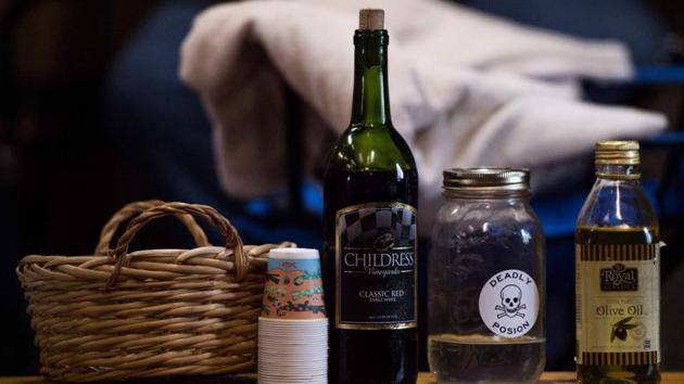 A bottle of strychnine (C), red wine for communion (L), and olive oil for blessings are seen at a Pentecostal serpent handlers service. There are an estimated 125 serpent-handling churches left. The movement is currently in decline, but it has waxed and waned over its 100 year history, and since the tradition is passed down from one generation to the next, it is likely to stay alive for many years to come. (Andrew Caballero-Reynolds / AFP) A bottle of strychnine (C), red wine for communion (L), and olive oil for blessings are seen at a Pentecostal serpent handlers service. There are an estimated 125 serpent-handling churches left. The movement is currently in decline, but it has waxed and waned over its 100 year history, and since the tradition is passed down from one generation to the next, it is likely to stay alive for many years to come. (Andrew Caballero-Reynolds / AFP)