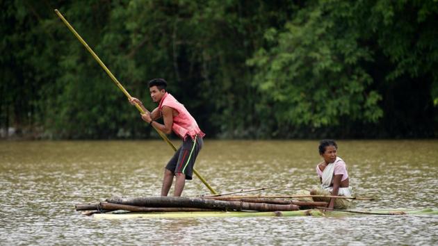 Villagers use a makeshift raft to cross a flooded area in the Nagaon district, Assam, on June 18, 2018. (Anuwar Hazarika / REUTERS) Villagers use a makeshift raft to cross a flooded area in the Nagaon district, Assam, on June 18, 2018. (Anuwar Hazarika / REUTERS)