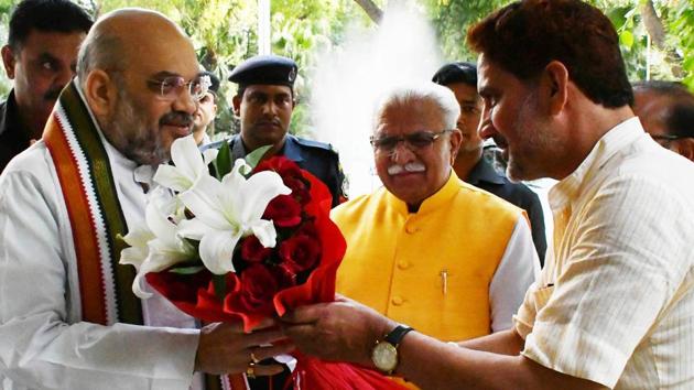 BJP state chief Subhash Barala (right) welcoming party national president Amit Shah as Haryana CM Manohar Lal Khattar looks on, at Haryana Bhawan in New Delhi on Friday. (HT Photo) BJP state chief Subhash Barala (right) welcoming party national president Amit Shah as Haryana CM Manohar Lal Khattar looks on, at Haryana Bhawan in New Delhi on Friday. (HT Photo)