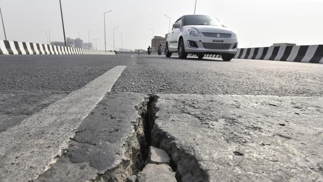 Experts said the roads, as well as the stormwater drains, are in a bad shape, and accumulated water on the road reduces the binding force of the bituminous road.(Sanjeev Verma/HT File Photo)