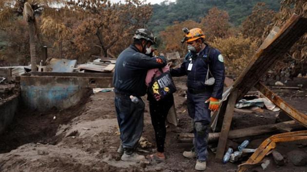 Garcia is embraced by a rescue worker as she searches for her family. As the days passed, three of her six children, 31, 22 and 19 years old, plus a granddaughter, appeared at different shelters. But the bodies of three of her children remained missing. “I will finish my search when I find them,” she said, drying her tears. (Carlos Jasso / REUTERS)