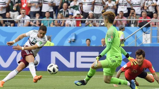 Mexico's Javier Hernandez, left, scores his side's second goal during the group F match between Mexico and South Korea at the 2018 soccer World Cup in the Rostov Arena in Rostov-on-Don. (AP)