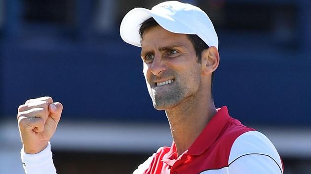 Novak Djokovic reacts after winning a point against Adrian Mannarino during their match at Queen’s Club tennis tournament.(AFP)