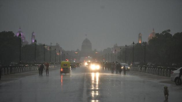 People are seen walking on the Rajpath during rain in New Delhi , India.(HT File Photo) People are seen walking on the Rajpath during rain in New Delhi , India.(HT File Photo)