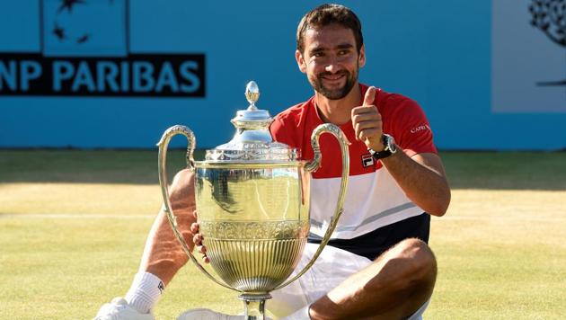 Croatia's Marin Cilic celebrates with the trophy after winning the Queen’s Club Championships final against Serbia's Novak Djokovic at the Queen's Club in London, Britain on June 24, 2018. (Action Images via Reuters) Croatia's Marin Cilic celebrates with the trophy after winning the Queen’s Club Championships final against Serbia's Novak Djokovic at the Queen's Club in London, Britain on June 24, 2018. (Action Images via Reuters)