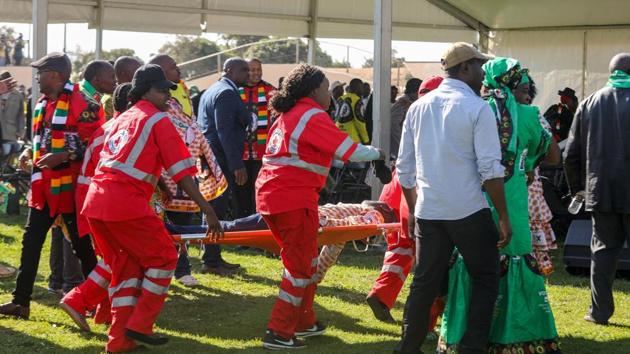 Medics attend to people injured in an explosion during a rally by Zimbabwean President Emmerson Mnangagwa in Bulawayo, Zimbabwe June 23.(REUTERS)