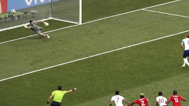 England's Harry Kane, top right, scores past Panama goalkeeper Jaime Penedo, his first penalty during the group G match between England and Panama. (AP) England's Harry Kane, top right, scores past Panama goalkeeper Jaime Penedo, his first penalty during the group G match between England and Panama. (AP)