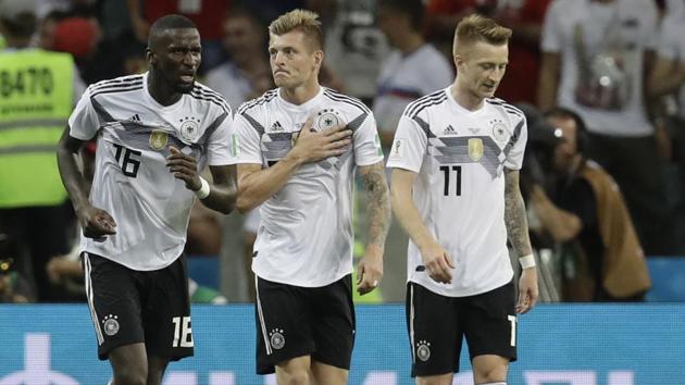 Germany's Toni Kroos celebrates after scoring his side's second goal with his teammate Germany's Antonio Ruediger, left, and Marco Reus, right, during the group F match between Germany and Sweden at the 2018 soccer World Cup.(AP)