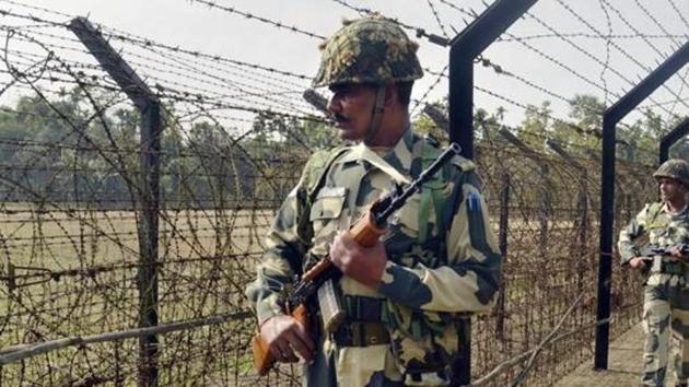 Border Security Force (BSF) personnel patrol along the India-Bangladesh border fence at Yakub Nagar village ahead of Republic Day in Dharmanagar, Tripura. (PTI File Photo) Border Security Force (BSF) personnel patrol along the India-Bangladesh border fence at Yakub Nagar village ahead of Republic Day in Dharmanagar, Tripura. (PTI File Photo)