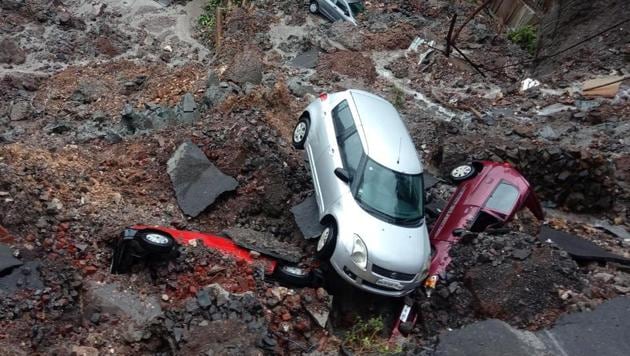 Several cars struck in debris after a wall collapsed at a construction site in Antop Hill, at Mumbai’s Wadala East area. After heavy rainfall over the weekend in the city, several areas witnessed traffic snarls due to heavy waterlogging and local trains running late. (Kunal patil / HT Photo) Several cars struck in debris after a wall collapsed at a construction site in Antop Hill, at Mumbai’s Wadala East area. After heavy rainfall over the weekend in the city, several areas witnessed traffic snarls due to heavy waterlogging and local trains running late. (Kunal patil / HT Photo)