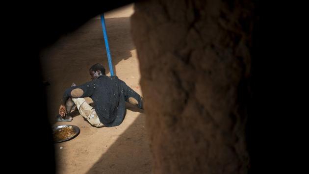 A migrant who was expelled from Algeria at the Arlit transit center with scars on his hands and arms was so traumatized that he never spoke and didn’t leave. The other migrants assumed he had endured the unspeakable in Algeria, a place where many said they had been robbed and beaten by authorities. (Jerome Delay / AP)
