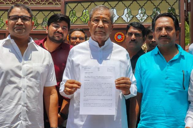 Rajasthan MLA Ghanshyam Tiwari (C) resigned from the BJP on Monday, accusing chief minister Vasundhara Raje of corruption and nepotism. His resignation letter to BJP president Amit Shah said, “The chief of state government in Rajasthan in collusion with some ministers and bureaucrats has been robbing the state and the level of corruption has scaled a new high.” Tiwari also accused Shah of inaction and having surrendered to corruption. (PTI) Rajasthan MLA Ghanshyam Tiwari (C) resigned from the BJP on Monday, accusing chief minister Vasundhara Raje of corruption and nepotism. His resignation letter to BJP president Amit Shah said, “The chief of state government in Rajasthan in collusion with some ministers and bureaucrats has been robbing the state and the level of corruption has scaled a new high.” Tiwari also accused Shah of inaction and having surrendered to corruption. (PTI)