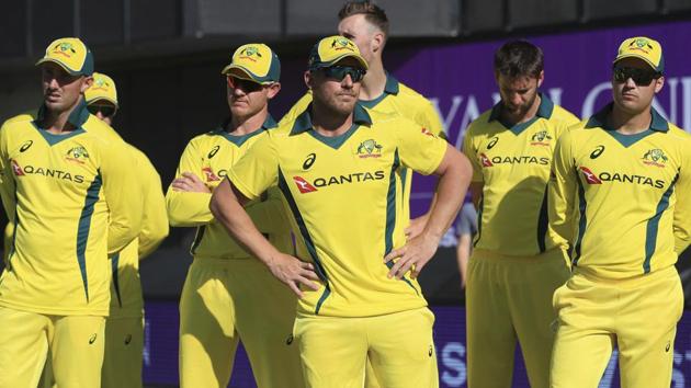 Australia players stand dejected after losing their One Day International cricket match against England at Emirates Old Trafford.(AP)