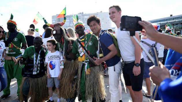 Japan and Senegal fans pose outside the Ekaterinburg Arena. The two teams played out a 2-2 draw on Sunday. (AFP)