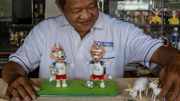 Retired Vietnamese English teacher Nguyen Thanh Tam displays two finished models of Zabivaka (L), the 2018 Russian World Cup mascot, made from eggshells, at his home in Ho Chi Minh City. Tam, 67, spends hours every day making the models, driven by his football fanaticism -- a passion shared by millions across Vietnam glued to the 2018 Football World Cup underway in Russia. (Thanh Nguyen / AFP) Retired Vietnamese English teacher Nguyen Thanh Tam displays two finished models of Zabivaka (L), the 2018 Russian World Cup mascot, made from eggshells, at his home in Ho Chi Minh City. Tam, 67, spends hours every day making the models, driven by his football fanaticism -- a passion shared by millions across Vietnam glued to the 2018 Football World Cup underway in Russia. (Thanh Nguyen / AFP)