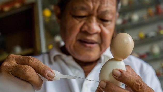Tam decided that an eggshell perfectly captured Saint Nick’s rotund belly. He eventually married his passion for crafts and football and started making World Cup mascots during the 2010 World Cup in South Africa. (Thanh Nguyen / AFP) Tam decided that an eggshell perfectly captured Saint Nick’s rotund belly. He eventually married his passion for crafts and football and started making World Cup mascots during the 2010 World Cup in South Africa. (Thanh Nguyen / AFP)