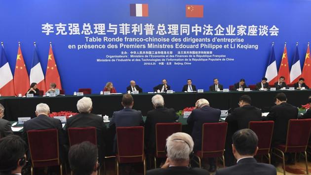 Chinese Premier Li Keqiang and French Prime Minister Edouard Philippe meet with French business leaders and entrepreneurs at the Great Hall of the People in Beijing on June 25. (AP Photo) Chinese Premier Li Keqiang and French Prime Minister Edouard Philippe meet with French business leaders and entrepreneurs at the Great Hall of the People in Beijing on June 25. (AP Photo)