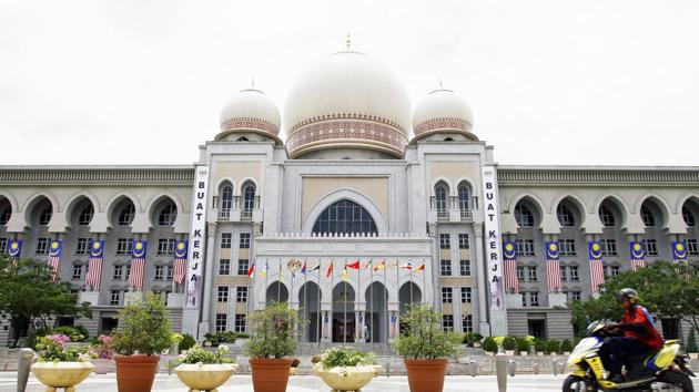 The pair, of East Asian appearance and believed to be foreigners, were filmed doing the dance in skimpy shorts and tops exposing their mid-riffs on a wall outside the main mosque in the city of Kota Kinabalu. (AFP Representative Photo) The pair, of East Asian appearance and believed to be foreigners, were filmed doing the dance in skimpy shorts and tops exposing their mid-riffs on a wall outside the main mosque in the city of Kota Kinabalu. (AFP Representative Photo)