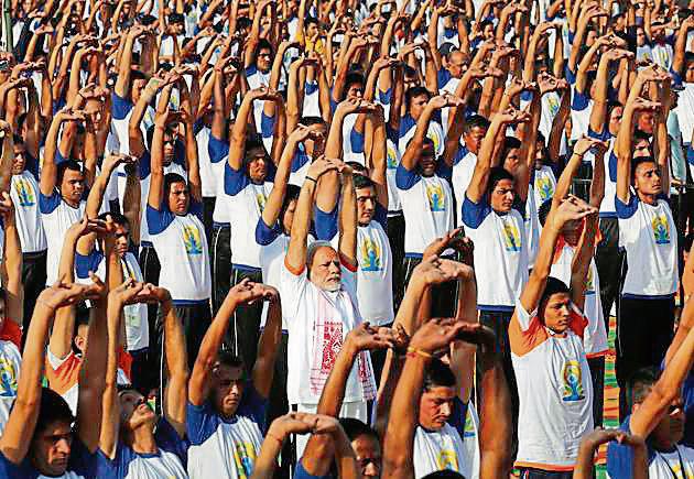 Prime Minister Narendra Modi performed yoga along with 50,000 others in Dehradun. Rawat said the hill state holds huge possibilities in the yoga and Ayurveda sectors.(AP File)