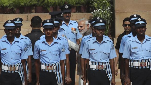 Prime Minister Narendra Modi talks to an Indian Air Force officer who collapsed while standing to offer guard of honour to visiting Seychelles President Danny Antoine Rollen Faure at the presidential palace in New Delhi on Monday. (AP Photo) Prime Minister Narendra Modi talks to an Indian Air Force officer who collapsed while standing to offer guard of honour to visiting Seychelles President Danny Antoine Rollen Faure at the presidential palace in New Delhi on Monday. (AP Photo)
