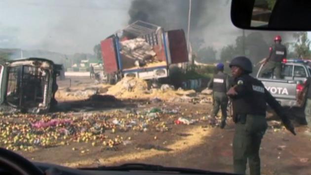 Destroyed vehicles and debris is strewn across the road as police attempt to restore calm, in the town of Jos, Nigeria, June 25, 2018. (AP Photo) Destroyed vehicles and debris is strewn across the road as police attempt to restore calm, in the town of Jos, Nigeria, June 25, 2018. (AP Photo)