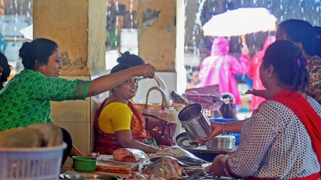 People carry containers at a fish market as Maharashtra government has banned the use of plastic bags, in Mumbai on Sunday, June 24, 2018. (PTI) People carry containers at a fish market as Maharashtra government has banned the use of plastic bags, in Mumbai on Sunday, June 24, 2018. (PTI)