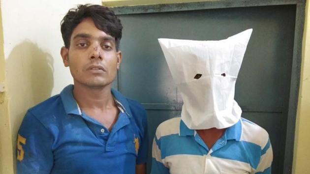 Accused in the ATM fraud in police custody. (HT Photo) Accused in the ATM fraud in police custody. (HT Photo)