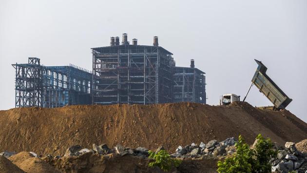 A dump truck unloads soil near the power plant. The problem is especially acute for state-owned banks that have lent to these projects, given that they are already reeling under the weight of their problem debts. Out of 21 government-controlled lenders, accounting for more than two-thirds of total loans in India, 19 reported losses in the three months to March 31. (Prashanth Vishwanathan / Bloomberg) A dump truck unloads soil near the power plant. The problem is especially acute for state-owned banks that have lent to these projects, given that they are already reeling under the weight of their problem debts. Out of 21 government-controlled lenders, accounting for more than two-thirds of total loans in India, 19 reported losses in the three months to March 31. (Prashanth Vishwanathan / Bloomberg)