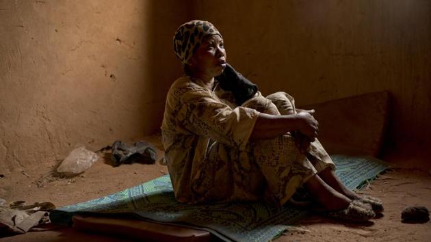 “Women were lying dead, other people got missing in the desert because they didn’t know the way,” said Janet Kamara, who was expelled in May and was pregnant at the time. Her body still aches from the dead baby she gave birth to during the trek. Now in Arlit, Niger, she is reeling from the time she spent in what she calls “the wilderness,” sleeping in the sand. (Jerome Delay / AP)