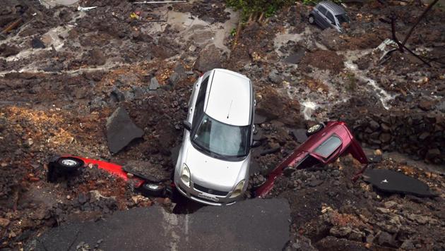 Several cars struck in debris after a wall collapsed at a construction site in Antop Hill, Wadala East area, in Mumbai.(PTI Photo) Several cars struck in debris after a wall collapsed at a construction site in Antop Hill, Wadala East area, in Mumbai.(PTI Photo)