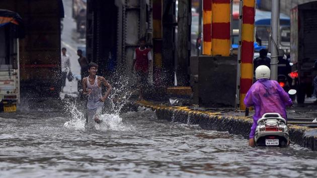 Rain continued to batter Mumbai, killing four people in 24 hours in the city and Thane district. Several areas witnessed traffic snarls and waterlogging which affected local train services. Kolkata and its neighbouring districts of Howrah, Hooghly, Nadia, North and South 24 Parganas were also lashed by torrential rains on Monday morning. (Shashank Parade / PTI) Rain continued to batter Mumbai, killing four people in 24 hours in the city and Thane district. Several areas witnessed traffic snarls and waterlogging which affected local train services. Kolkata and its neighbouring districts of Howrah, Hooghly, Nadia, North and South 24 Parganas were also lashed by torrential rains on Monday morning. (Shashank Parade / PTI)