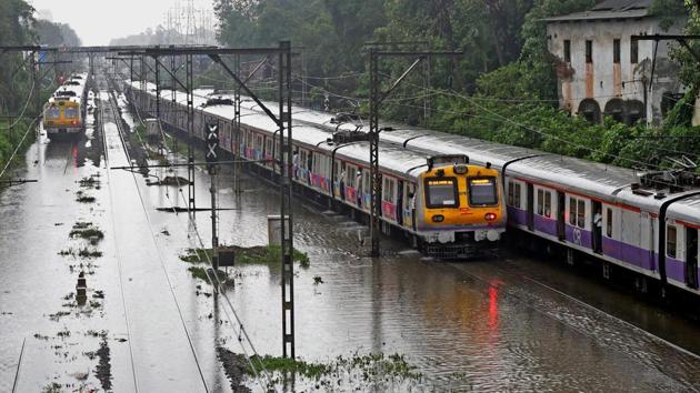 Mumbai rains: A train chugs on water-logged tracks during heavy rains, in Mumbai on Monday, June 25, 2018. (PTI Photo) Mumbai rains: A train chugs on water-logged tracks during heavy rains, in Mumbai on Monday, June 25, 2018. (PTI Photo)