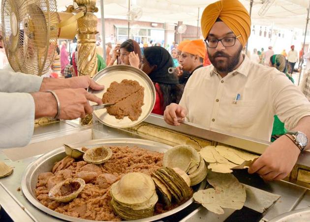 Apart from the act of serving the ‘degh’ inside the sanctum sanctorum during Amrit Vela (early morning) diwan, the parshad is served almost throughout the day near Darshani Deodi, the entry to the sanctum sanctorum. (Sameer Sehgal/HT) Apart from the act of serving the ‘degh’ inside the sanctum sanctorum during Amrit Vela (early morning) diwan, the parshad is served almost throughout the day near Darshani Deodi, the entry to the sanctum sanctorum. (Sameer Sehgal/HT)