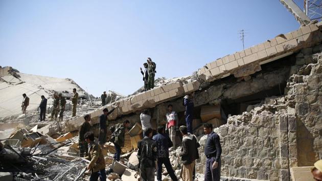 Policemen and people search for victims at the site of a Saudi-led airstrike on the police headquarters in Sanaa, Yemen. File Photo(AP) Policemen and people search for victims at the site of a Saudi-led airstrike on the police headquarters in Sanaa, Yemen. File Photo(AP)