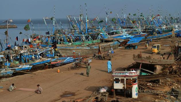 Pakistani fishermen gather at the harbour in the Ibrahim Hyderi area in Karachi. With animal rights at their nadir and religious sentiment in the Muslim country partly to blame for a prejudice against dogs, the figures spark a brutal culling each year that sees bodies pile up in the streets, rotting in the sweltering heat as they wait to be bulldozed away. (Rizwan Tabassum / AFP) Pakistani fishermen gather at the harbour in the Ibrahim Hyderi area in Karachi. With animal rights at their nadir and religious sentiment in the Muslim country partly to blame for a prejudice against dogs, the figures spark a brutal culling each year that sees bodies pile up in the streets, rotting in the sweltering heat as they wait to be bulldozed away. (Rizwan Tabassum / AFP)
