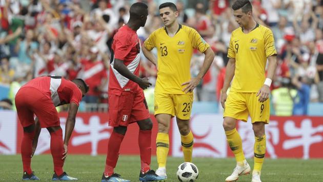 Australia's Tom Rogic, center and Australia's Tomi Juric, right, react after Peru's Paolo Guerrero scored his side' second goal. (AP) Australia's Tom Rogic, center and Australia's Tomi Juric, right, react after Peru's Paolo Guerrero scored his side' second goal. (AP)