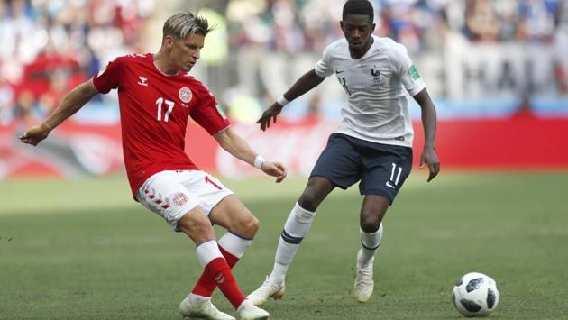 Denmark's Jens Stryger Larsen pass the ball as France's Ousmane Dembele goes to tackle during the group C match. Get highlights of France vs Denmark FIFA World Cup 2018 Group C match here.(AP)