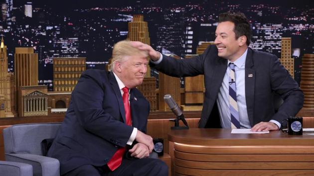 US President Donald Trump appears with host Jimmy Fallon during a taping of The Tonight Show Starring Jimmy Fallon, in New York. Fallon is opening up about the personal anguish he felt following the backlash to his now-infamous hair mussing appearance with Donald Trump. Trump opponents criticized Fallon for a cringeworthy interview only weeks before the election where Fallon playfully stroked Trump’s hair. (AP) US President Donald Trump appears with host Jimmy Fallon during a taping of The Tonight Show Starring Jimmy Fallon, in New York. Fallon is opening up about the personal anguish he felt following the backlash to his now-infamous hair mussing appearance with Donald Trump. Trump opponents criticized Fallon for a cringeworthy interview only weeks before the election where Fallon playfully stroked Trump’s hair. (AP)