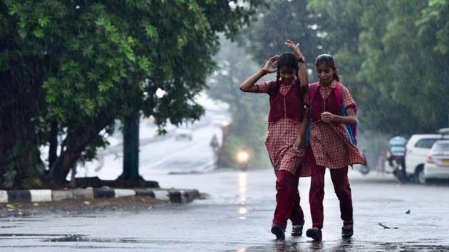 Delhi woke to a welcome change from its scorching heat, with spells of rain witnessed here on Wednesday morning. This pre-monsoon spell also caused a six degree dip in temperatures to 27 degrees Celsius. However, the meteorological department has predicted severe thunderstorms prior to the monsoon in North West India. (Burhaan Kinu / HT Photo)