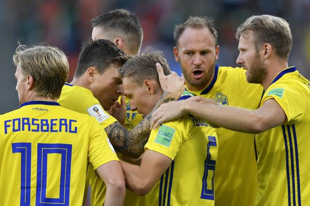Sweden's Ludwig Augustinsson, center, celebrates with teammates after scoring his side's first goal. (AP)