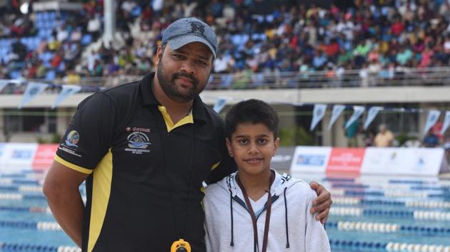 Shashwat Bhome (right), bronze medallist, and his coach Narendra Acharekar at the national swimming competition at Shree Chhatrapati Shivaji Sports Complex, Balewadi. (Pratham Gokhale/HT Photo) Shashwat Bhome (right), bronze medallist, and his coach Narendra Acharekar at the national swimming competition at Shree Chhatrapati Shivaji Sports Complex, Balewadi. (Pratham Gokhale/HT Photo)