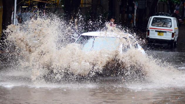 Moses may have split the sea to allow a path through, but the ordinary Puneite have to use his beloved car to make a path through the water logged roads in Kharadi. (Shankar Narayan/HT PHOTO) Moses may have split the sea to allow a path through, but the ordinary Puneite have to use his beloved car to make a path through the water logged roads in Kharadi. (Shankar Narayan/HT PHOTO)