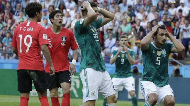 Germany's Mario Gomez, center, and Germany's Mats Hummels, right, hold their heads after failing to score against South Korea in a FIFA World Cup 2018 Group F match.(AP)