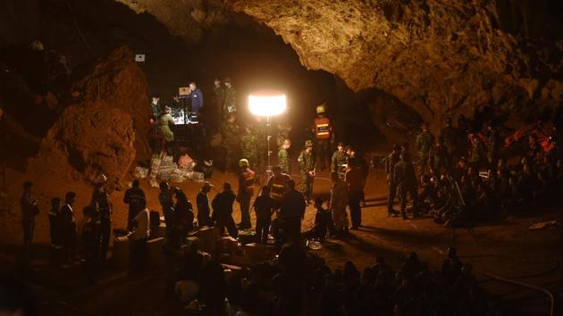 Thai soldiers relay electric cable deep into the cave at Chiang Rai’s Khun Nam Nang Non Forest Park during the rescue operation. Volunteers and military teams, including a navy SEAL unit, struggled through flood waters inside the cave on Wednesday in a search for the missing. (Lillian Suwanrumpha / AFP) Thai soldiers relay electric cable deep into the cave at Chiang Rai’s Khun Nam Nang Non Forest Park during the rescue operation. Volunteers and military teams, including a navy SEAL unit, struggled through flood waters inside the cave on Wednesday in a search for the missing. (Lillian Suwanrumpha / AFP)