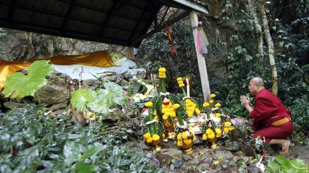 A Thai Buddhist monk prays as desperate parents led a prayer ceremony outside the flooded cave. Hundreds of people have been mobilised to find the youngsters who are trapped in Tham Luang cave when heavy rainfall flooded its main entrance. (Sakchai Lalit / AP) A Thai Buddhist monk prays as desperate parents led a prayer ceremony outside the flooded cave. Hundreds of people have been mobilised to find the youngsters who are trapped in Tham Luang cave when heavy rainfall flooded its main entrance. (Sakchai Lalit / AP)